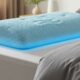 Cooling gel memory foam pillow with breathable cover on bed